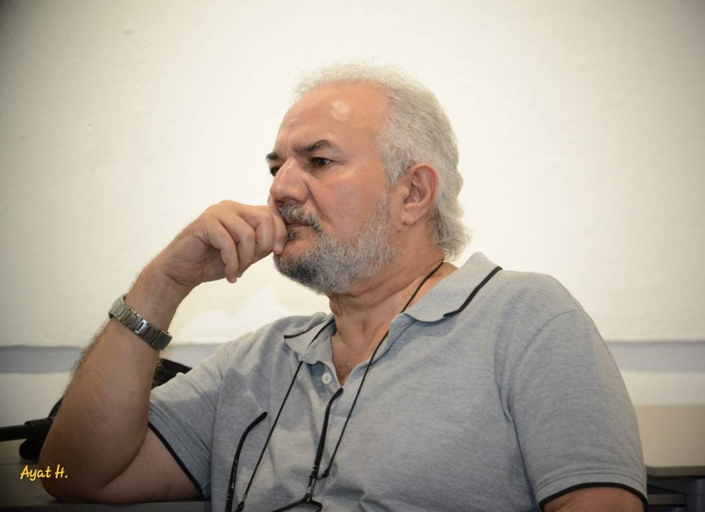 Picture of another man, listening intently.