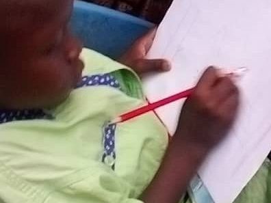 A child drawing on a paper
